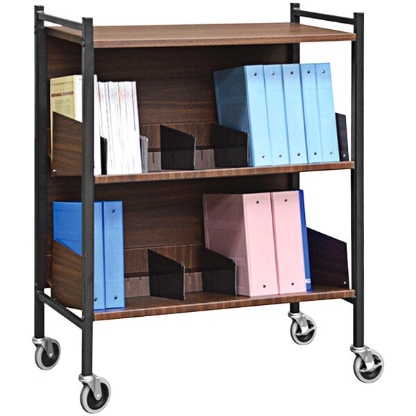 An Omnimed woodgrain cabinet rack with shelves holding binders and folders on wheels.