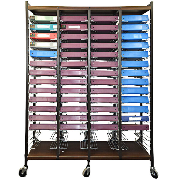 An Omnimed woodgrain cart with many colorful files in the drawers.