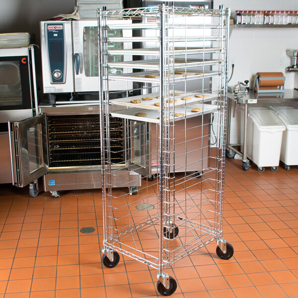 A Metro unassembled sheet pan rack with trays on it.