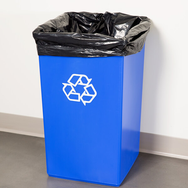A blue Continental SwingLine recycling container with black plastic on top.