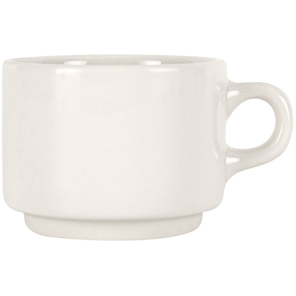 A white Tuxton latte mug with a handle.
