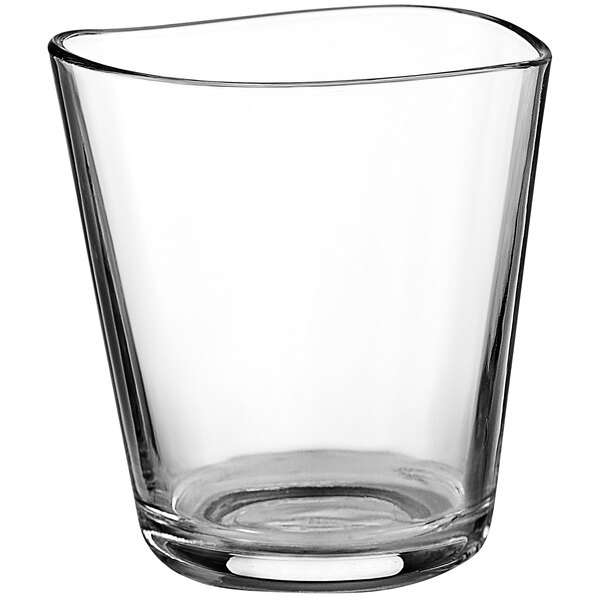 A clear Centique rocks glass with a curved edge.