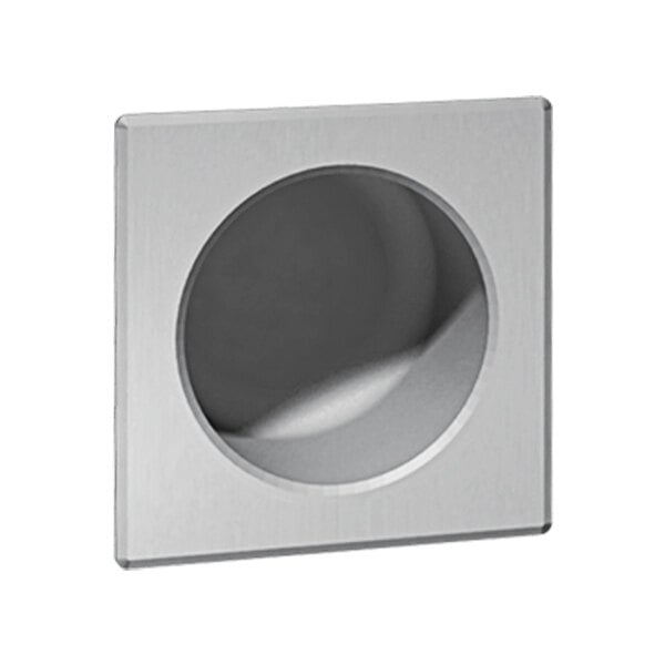 A white square metal Chase-mounted toilet tissue holder with a round hole in the center.