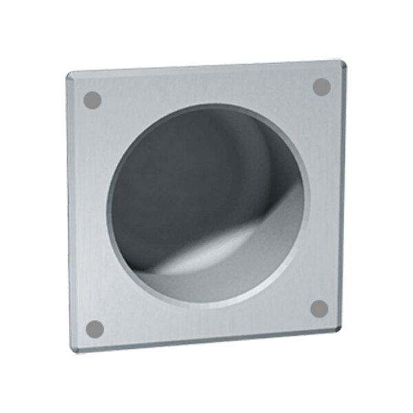 A square metal recessed toilet paper holder with a hole in the center.