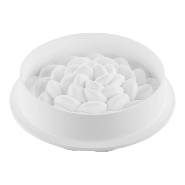 A white silicone baking mold with a bunch of white flowers inside.