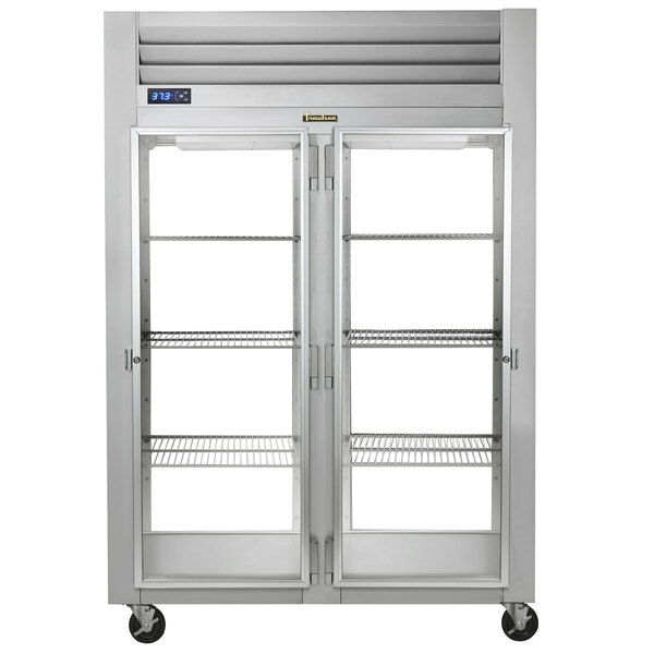 A Traulsen reach-in refrigerator with dual glass doors and shelves.