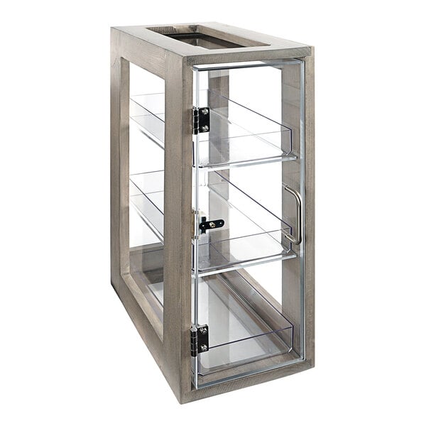 A Cal-Mil gray pine bread display case with three shelves and a glass door.