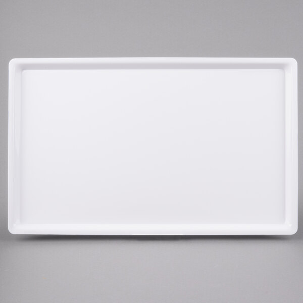A white rectangular Cal-Mil bakery tray with a white border.