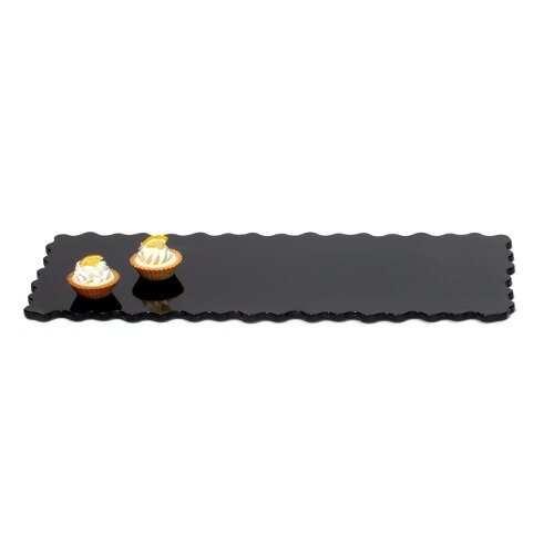 A black rectangular tray with two cupcakes on it.