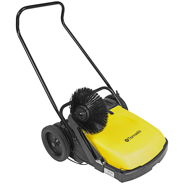 A yellow and black Tornado manual push sweeper with a brush.