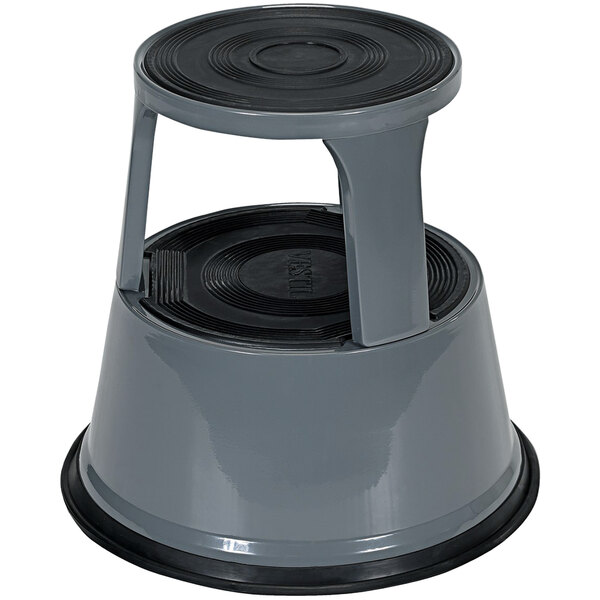 A Vestil grey steel rolling step stool with a black top and black rubber feet.