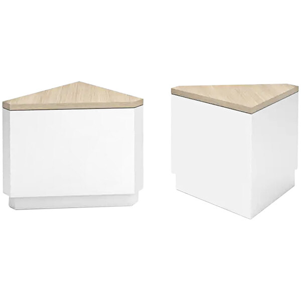 A white and wooden corner retail counter with a white top.
