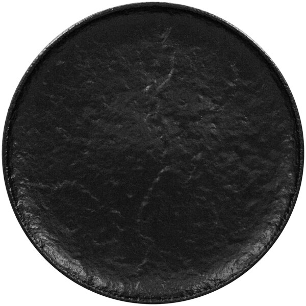 A black RAK Porcelain flat coupe plate with a rough surface.