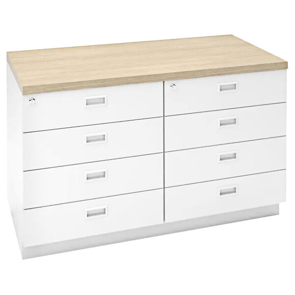 A white and wood Econoco retail counter with drawers.
