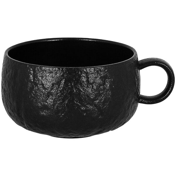 A black porcelain breakfast cup with a handle.