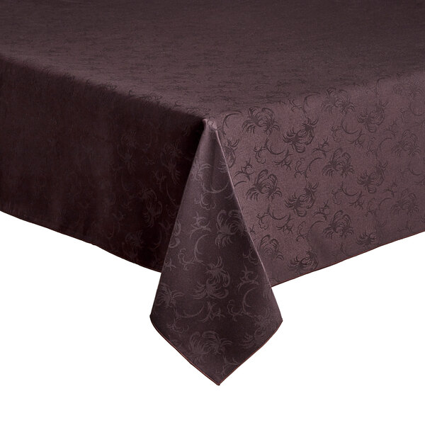 A brown Snap Drape Windsor Damask tablecloth with a floral pattern on a table.