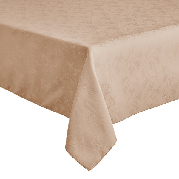 A Snap Drape Windsor Damask Sandalwood table cloth with a floral pattern on a table.