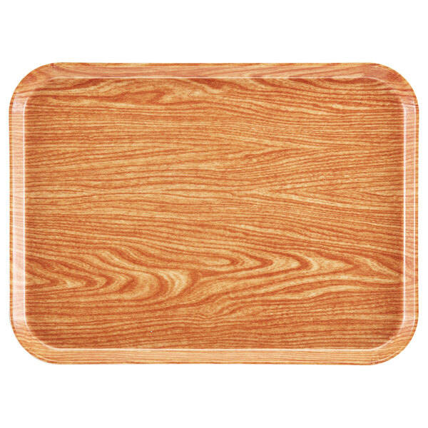 A rectangular light elm Cambro tray with a wood grain pattern.