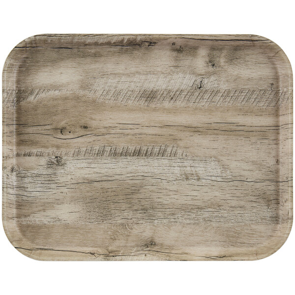 A Cambro light oak wood tray with non-skid surface.