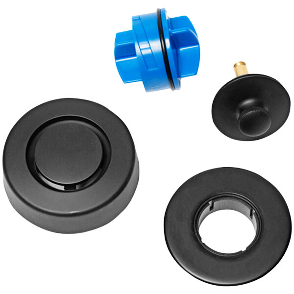 A group of black and blue plastic parts including a black circular Uni-Lift stopper with a blue plastic cap and black bands on a table.