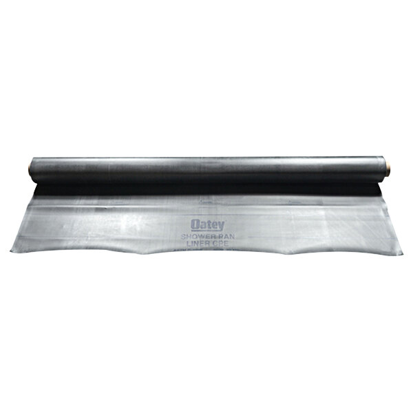 A roll of black plastic Oatey shower pan liner.
