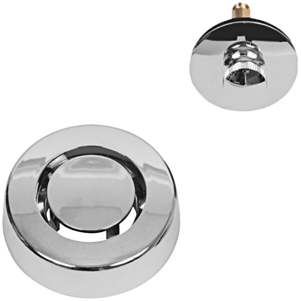 A chrome plated metal circular object with a hole.