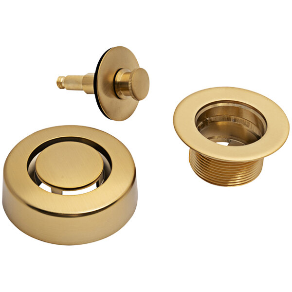 A Dearborn brushed gold trim kit with brass fittings and push n' pull stopper.
