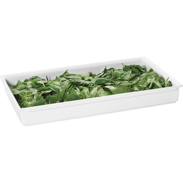A white GET Bugambilia full size food pan filled with spinach leaves.