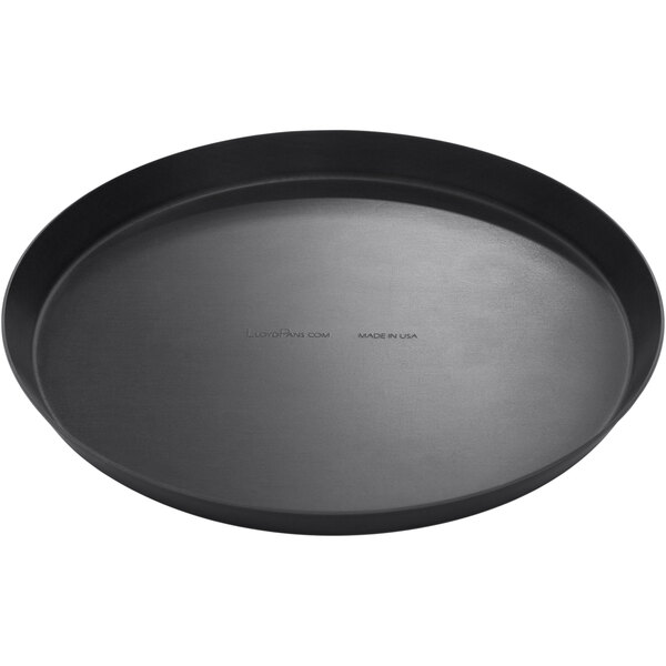 A black round LloydPans pizza cutter pan on a table.