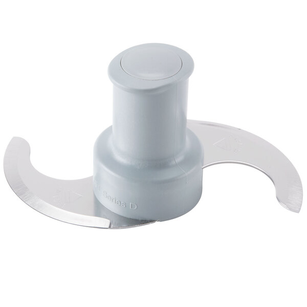 A white plastic Robot Coupe food processor blade with a metal "S" shaped edge.