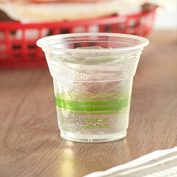 A World Centric clear plastic cup filled with water and ice.