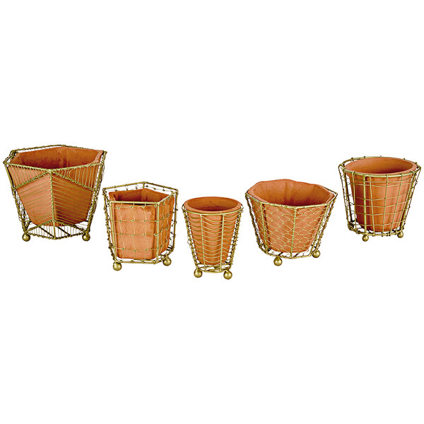 A group of terracotta pots with wire mesh around them.