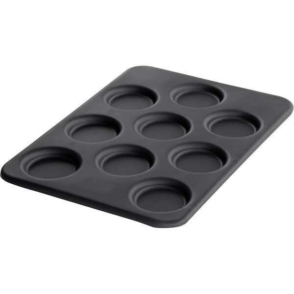 A black LloydPans round egg pan with 9 compartments.