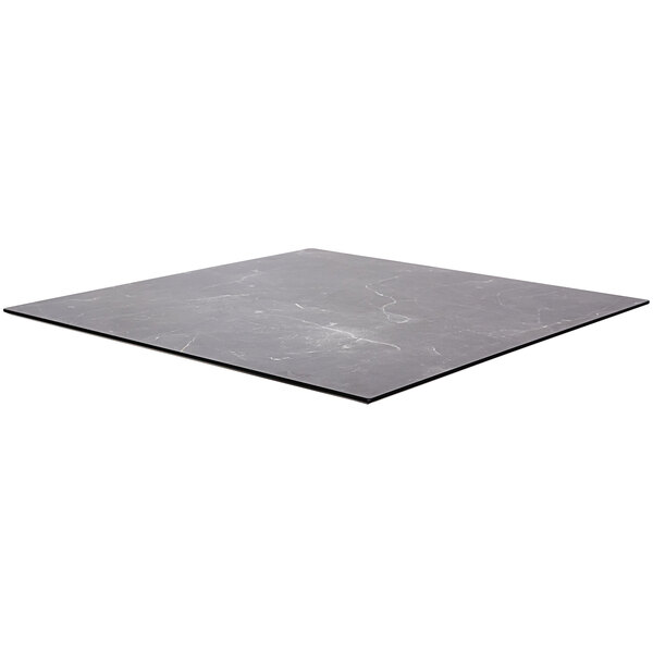 A square black table top with white veins.