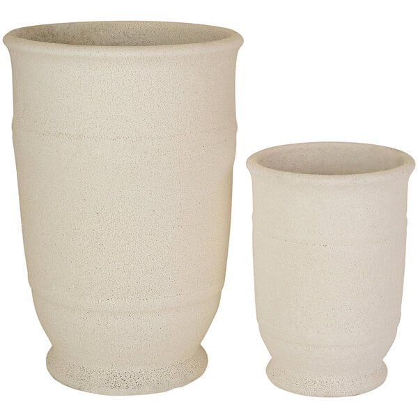 A pair of white cylindrical ceramic vases with lids.