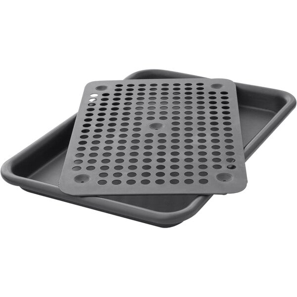 A close-up of a LloydPans black perforated roaster tray with a lid.