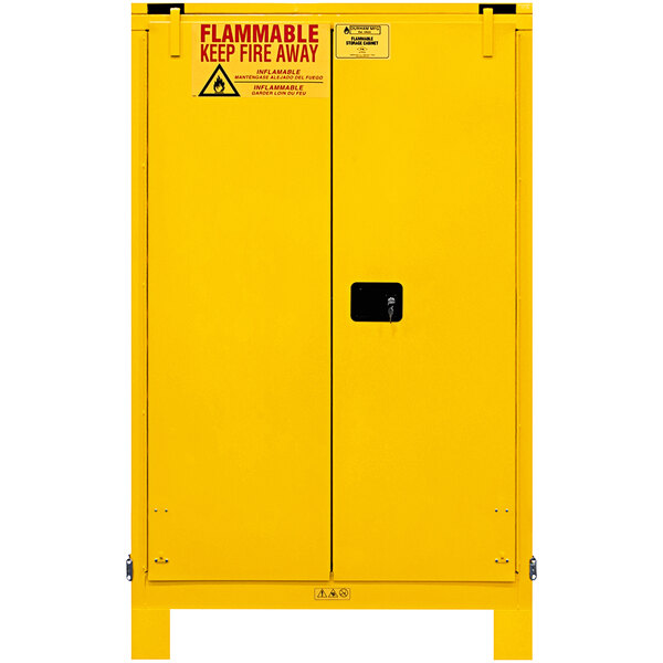 A yellow Durham Mfg safety cabinet with self-closing doors and a warning sign.