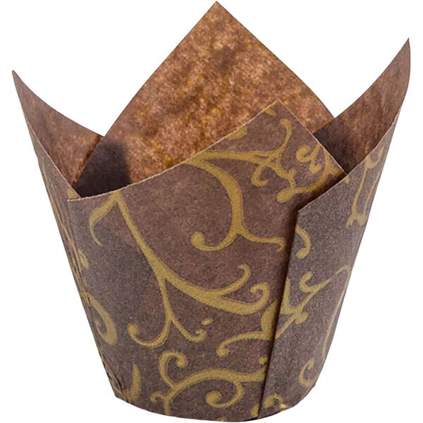 A brown paper Novacart tulip baking cup with a gold pattern.