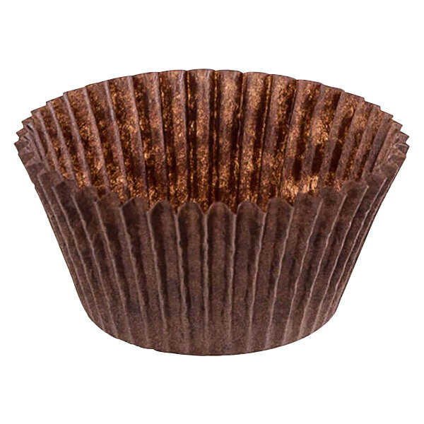 A brown fluted paper Novacart baking cup.