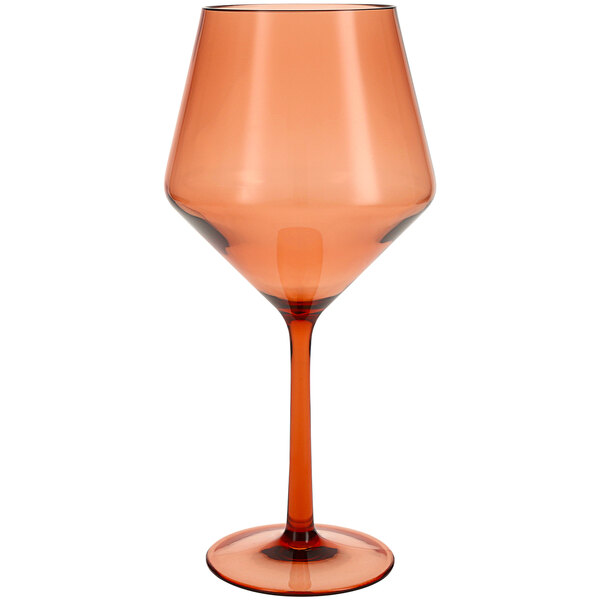 A close up of a Fortessa Sole Terra Cotta Tritan plastic wine glass with an orange rim.