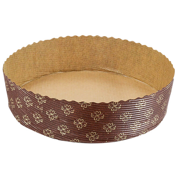 A brown and gold paper baking mold with a design.