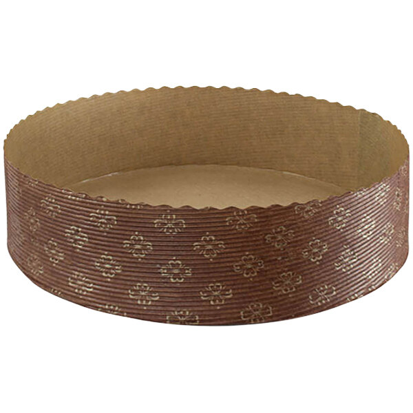 A round brown paper baking mold with a gold pattern.