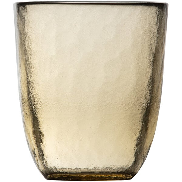 A Fortessa Los Cabos ginger glass tumbler with a brown rim.