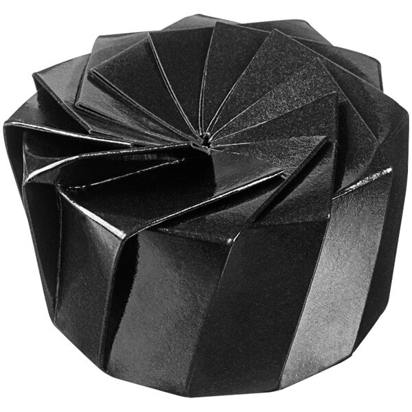 A Solia black origami bowl with a spiral design.