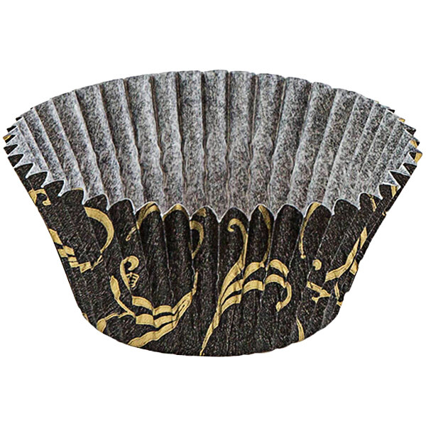 A Novacart black cupcake liner with gold designs.