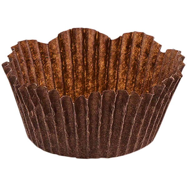A close up of a brown paper Novacart petal baking cup with a fluted edge.
