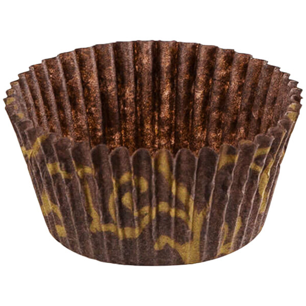 A brown paper Novacart cupcake wrapper with gold and brown designs.