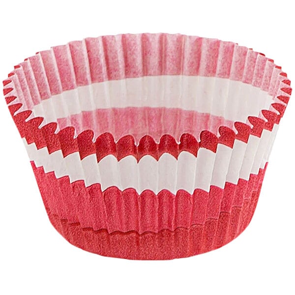 A red fluted cupcake wrapper with a white circle.