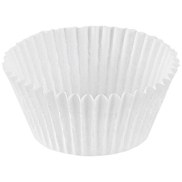 A close-up of a white Novacart fluted paper baking cup.