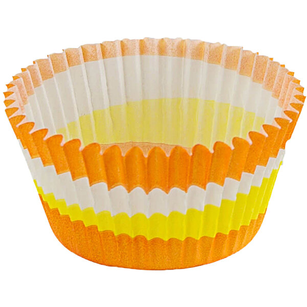 A Novacart paper cupcake wrapper with yellow and orange stripes.